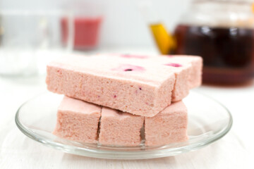 Pink fruit marshmallow with cranberries closeup.