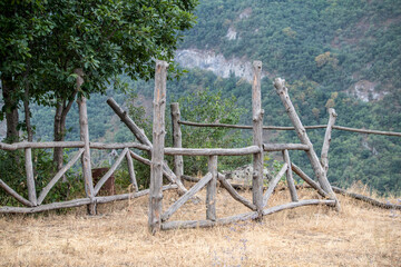 Fototapeta premium mountain landscape with a wooden fence against the backdrop of mountains in Armenia