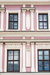 Fototapeta premium The facade of a Renaissance tenement house in pink. Zamosc, Poland