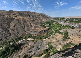 panoramic view of a mountain landscape with an old Christian church against the sky in Armenia taken from a drone