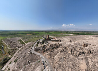 panoramic view of a mountain landscape with an old Christian church against the sky in Armenia taken from a drone