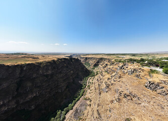 panoramic view of a mountain landscape with a gorge against the sky in Armenia taken from a drone