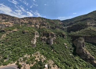 Fototapeta na wymiar panoramic view of a mountain landscape with a gorge against the sky in Armenia taken from a drone
