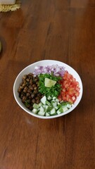 black chickpeas and vegetables in a bowl