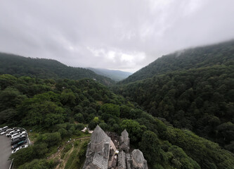 Fototapeta na wymiar panoramic view of a mountain landscape with ancient stone buildings in Armenia taken from a drone