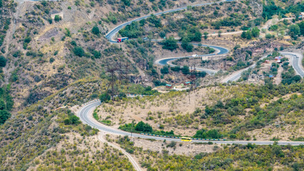 panoramic views of ancient temples and buildings in picturesque places in a gorge in the mountains of Armenia taken from a drone