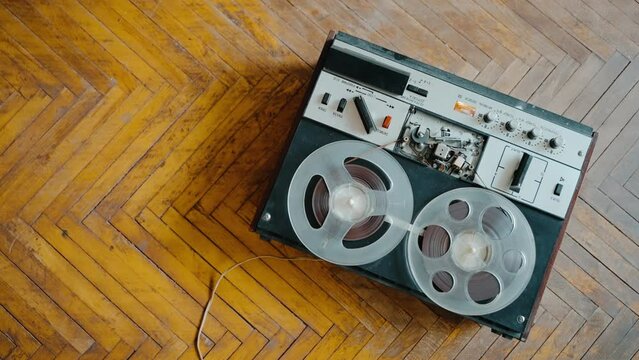 Close-up playback in an old reel-to-reel tape recorder.