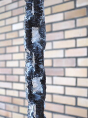 steel chain covered with winter ice