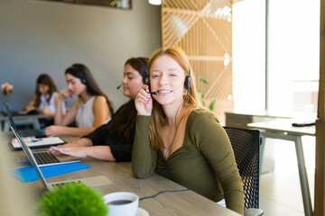 Smiling caucasian woman working customer support