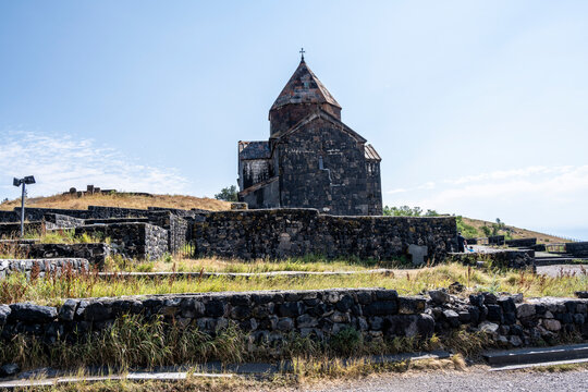landscape with views of ancient stone buildings and temples on a summer day near Lake Sevan in Armenia