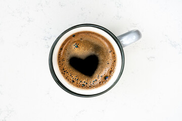 cup of coffee with heart shape on foam