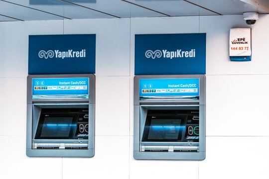 10 July 2022, Antalya, Turkey: Two ATMs for money withdrawal at the YapiKredi bank financial department office. Deposit and money savings account concept