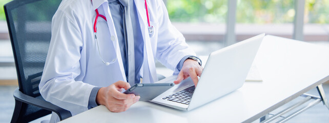 Doctor using online health consulting on computer pc and digital tablet, Tele medical healthcare concept, Banner with copy space
