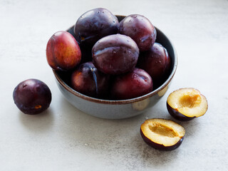 fresh plums in a bowl