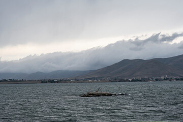 landscape with views of Lake Sevan and mountains and clouds on a summer day in Armenia