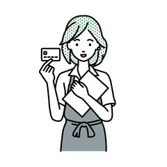 立って書類とカードを手に持つ店員の女性