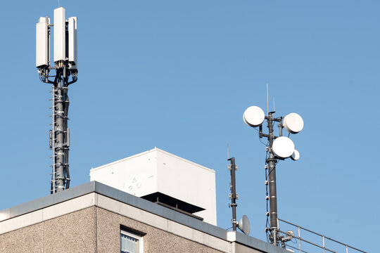 mobile phone antenna tower on a roof
