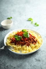 Pasta with spicy meat ragout and chili