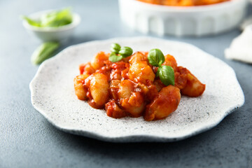 Baked potato gnocchi with tomato sauce and basil