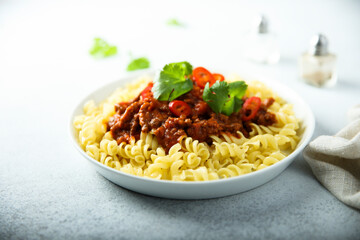 Pasta with spicy meat ragout and chili