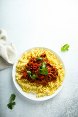 Pasta with spicy meat ragout and chili