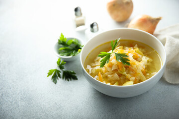 Traditional homemade sauerkraut soup with fresh parsley