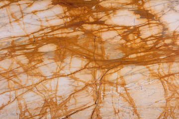 Giallo Siena natural marble stone texture, photo of slab. Glossy marble with beige streaks....
