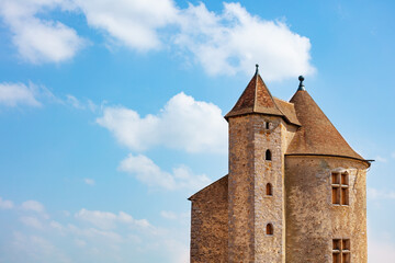 Fototapeta na wymiar Beautiful view of medieval castle square towers over blue sky