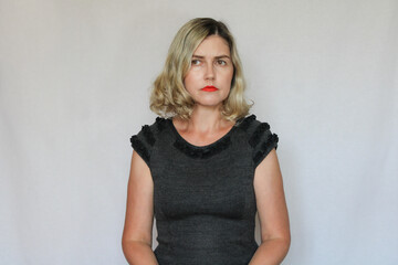 Fototapeta premium Beautiful middle-aged blond woman on a white background