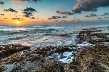 water flowing on the rocks in the beach Tel aviv Israel
