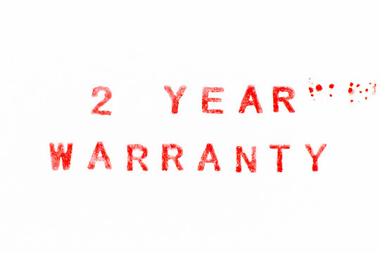 Red color ink rubber stamp in 2 word year warranty on white paper background
