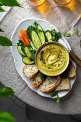 zucchini, carrot, onion and cream cheese dip with fresh vegetables and bread