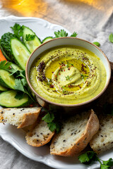 zucchini, carrot, onion and cream cheese dip with fresh vegetables and bread