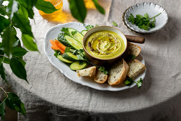 zucchini, carrot, onion and cream cheese dip with fresh vegetables and bread