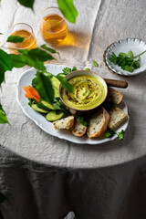 zucchini, carrot, onion and cream cheese dip with fresh vegetables and bread