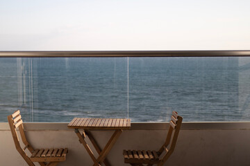 Cozy place at the balcony with sea background