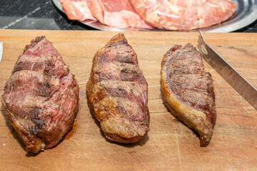 grilled picanha steaks on cutting board