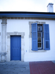 Beautiful blue door with windows in old building in Cyprus