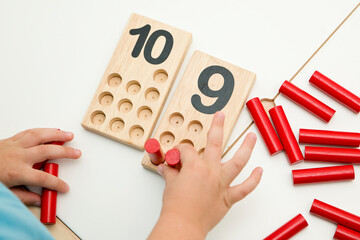 Wooden figures of the Montessori methodology. Math kids counting puzzle for kids. Educational...