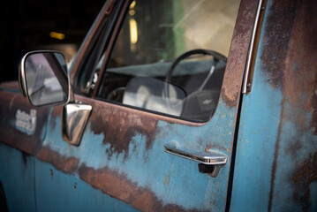 Classic, vintage truck, rat rod, with paint pealing off at the garage