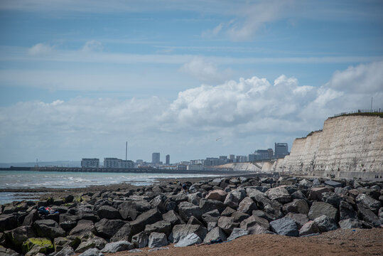 Large Stone Wave Breakers On The Rottington Beach With Visible Brighton In A Background