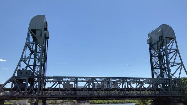the Broadway Bridge, view from below as cars pass; a double deck vertical lift bridge, connecting Inwood in Northern Manhattan to Marble Hill and the Bronx from across the Harlem River Ship Canal