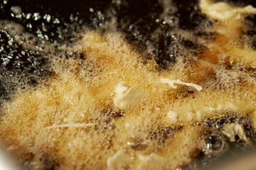 food being fried in oil	