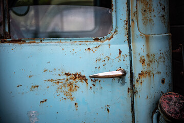 Classic, vintage truck, rat rod, with paint pealing off at the garage