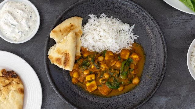 Rotating Plate of Vegetarian Indian Paneer Curry