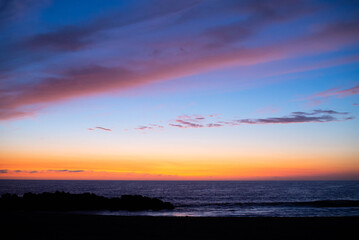 Sunset time over the sea with dramatic clouds.