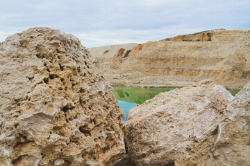 Lake formation in an old abandoned quarry. Quarry lake.