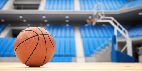 Basketball ball on basketball court in an empty basketball arena.