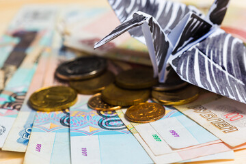 Conceptual photography with the Russian rubles and a symbol of random events - the black Swan in...