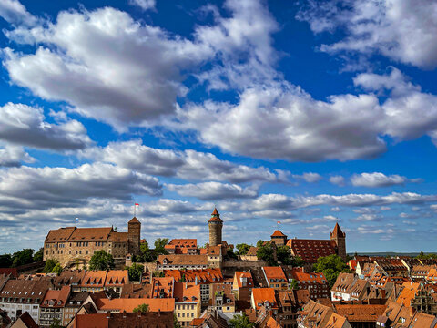 Kaiserburg Nuremberg with cloudy blue sky, a landmark of the Franconian metropolis in the north of Bavaria,Germany. The castle is the tourist highlight above the old town and is visited by travelers. 